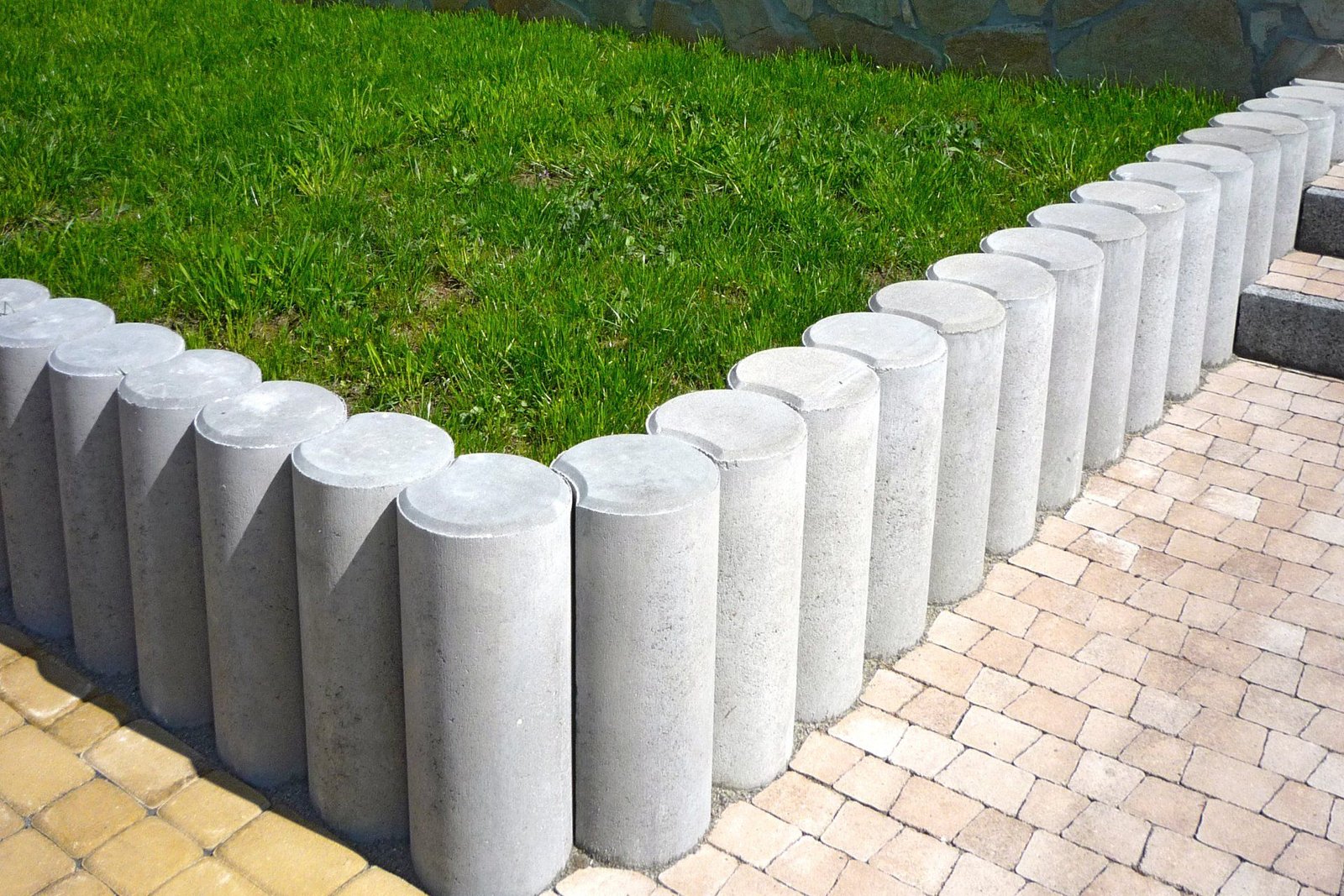Newly installed concrete retaining walls around a mini garden in a residential concreting project in Willetton WA.